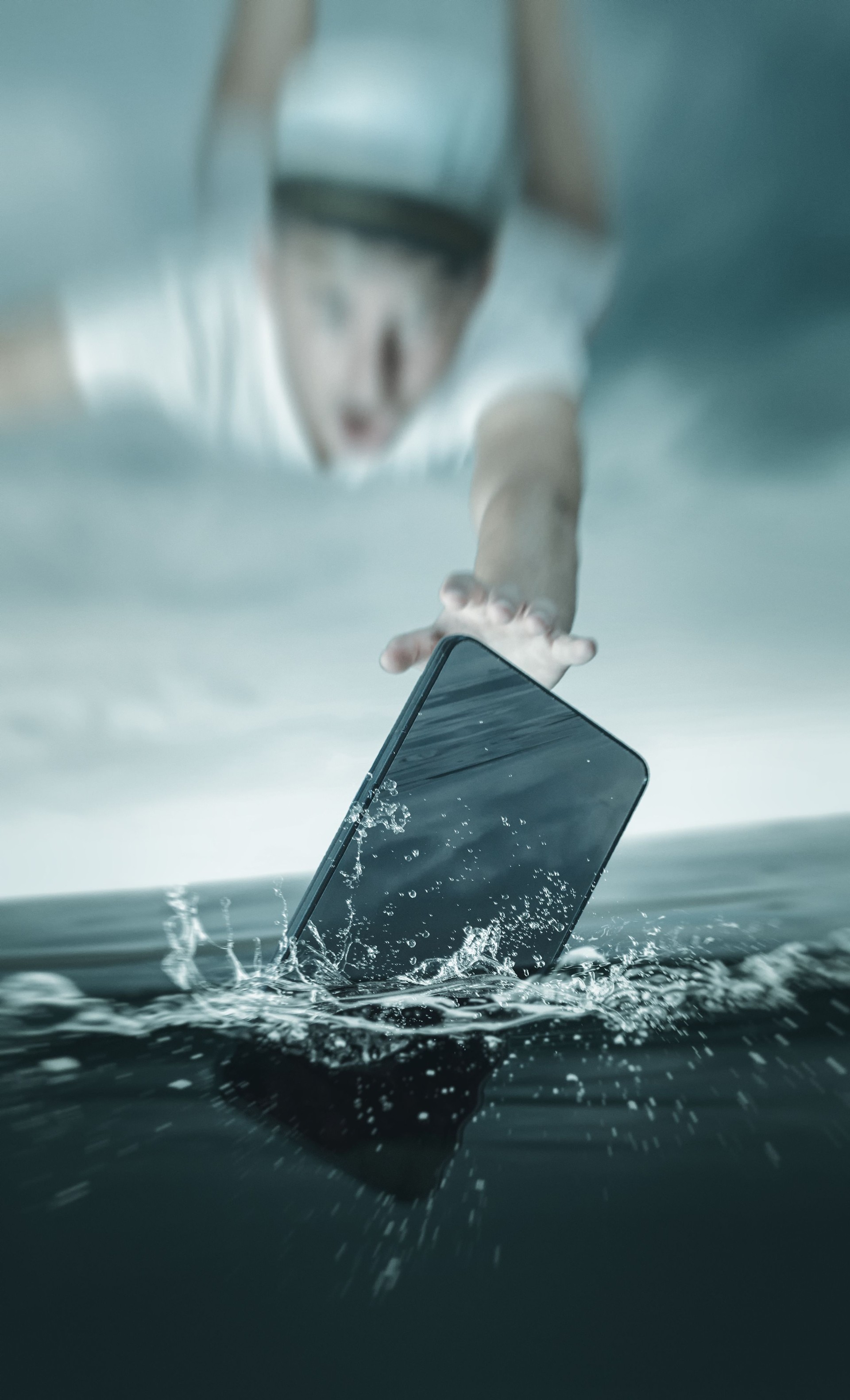 young captain flying after smartphone which falling into sea water